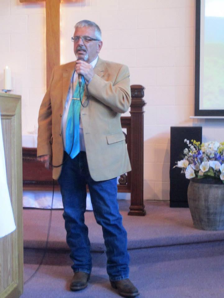 Kingdom Hall during a well-attended public talk event, with the community gathering to hear a Bible-based discourse